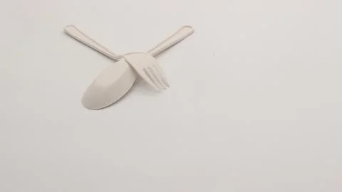 White plastic spoon and fork isolated Stock Photos