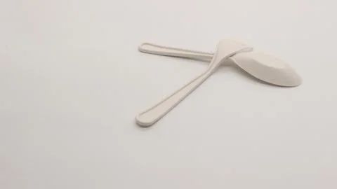 White plastic spoon and fork isolated Stock Photos