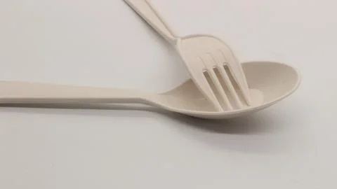 White plastic spoon and fork isolated Stock Photos