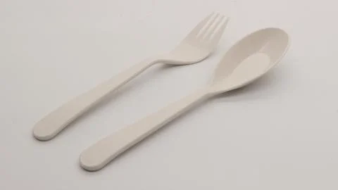 White plastic spoon and fork isolated Stock Photos