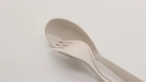 White plastic spoon and fork isolated Stock Photos