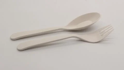 White plastic spoon and fork isolated Stock Photos