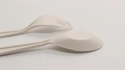 White plastic spoon and fork isolated Stock Photos