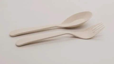 White plastic spoon and fork isolated Stock Photos
