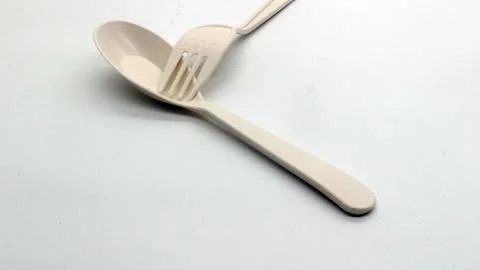White plastic spoon and fork isolated Stock Photos