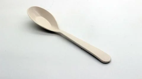 White plastic spoon and fork isolated Stock Photos