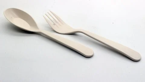White plastic spoon and fork isolated Stock Photos