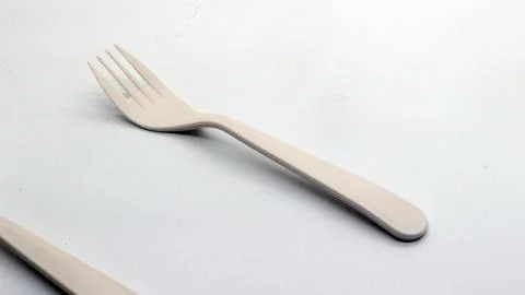 White plastic spoon and fork isolated Stock Photos