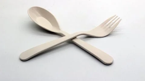 White plastic spoon and fork isolated Stock Photos