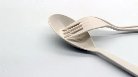 White plastic spoon and fork isolated Stock Photos