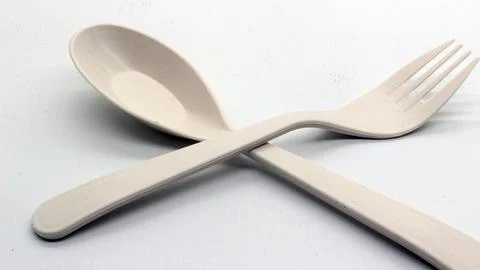 White plastic spoon and fork isolated Stock Photos