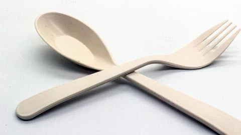 White plastic spoon and fork isolated Stock Photos