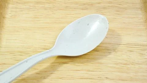 White Plastic Spoon with isolated background Stock Photos