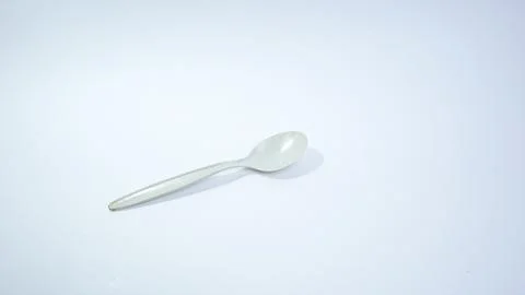 White Plastic Spoon with isolated background Stock Photos