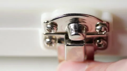 White plastic suitcase metal latch snapping open closed hand motion detail Stock Footage 320895916