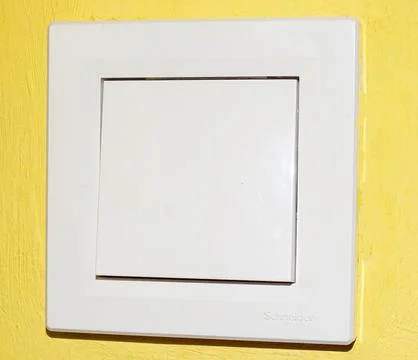 White plastic switch on a wall 스톡 사진