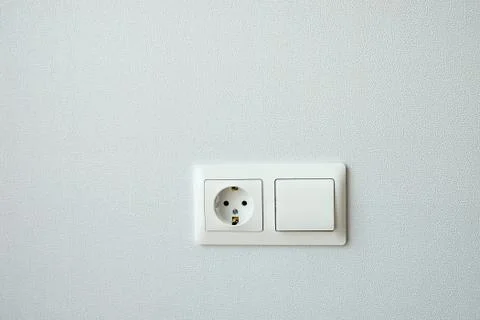 White plastic switched double socket. Light switch and power socket control p Foto stock