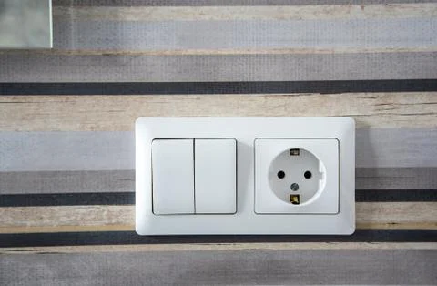 White plastic switched double socket. Light switch and power socket control p Stock Photos