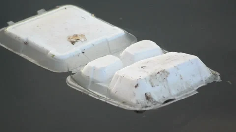 White plastic termopack floating on the river 스톡 동영상 36717631