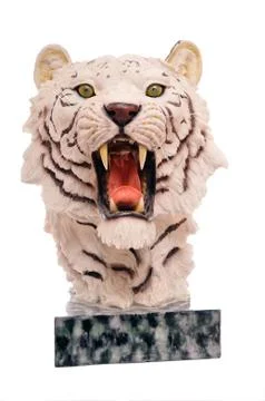 White plastic tiger head on marble rock isolated on white Stock Photos