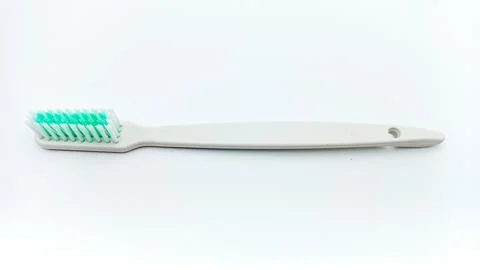 White Plastic Toothbrush Isolated On White Background Stock Photos