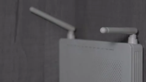 White plastic wifi router fixed on wooden wall of home or office room. Stock-Footage 170561831