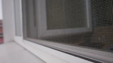 White Plastic Window Frame with Protective Mosquito Net Insect Screen Video stock 334735825