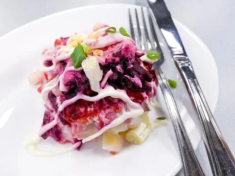 White plate with beetroot vegetable salad. Photo Stock Photos