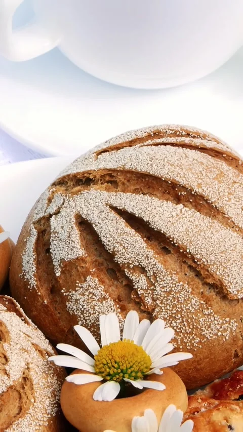 White plate with pastries, biscuits and cookies, decorated with white daisies. Stock Footage 317698117