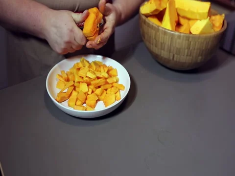 White plate with pumpkin slices Stock Footage 76980761