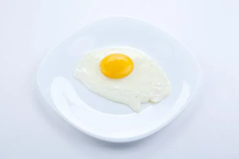 White plate with scrambled eggs Stock-Fotos