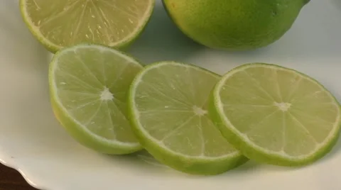 White plate with slices of lemon Stock Footage 55407858