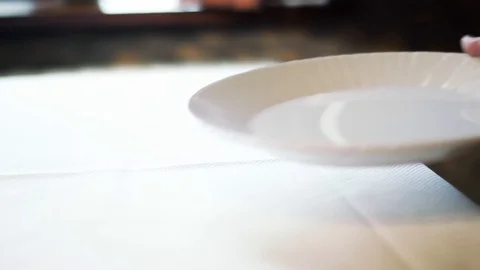 White plate on a table Stock-Footage 129428721