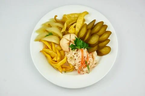 A white plate topped with different types of food Stock Photos