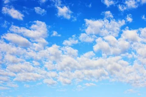 White plumose clouds.Cloudy blue sky. Stock Photos
