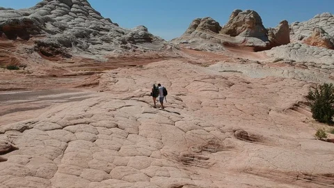 White pocket: two people exploring nature wonders Stock Footage 107878759