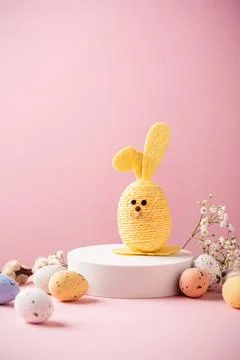 White podium with Easter quail eggs Stock Photos