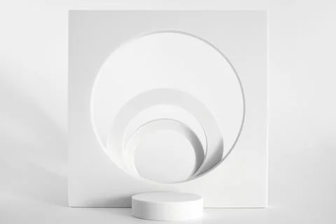 White podium on the white background, simple geometric forms. Podium for prod Stock Photos