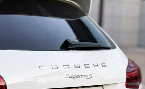 White Porsche Cayenne S E2 958 sports SUV in parked lot. Stock Photos