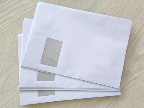 White postal envelopes with address window Stock Photos