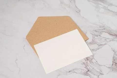 White postcard and brown envelope Stock Photos