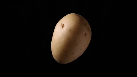 White potato rotating on black background 03 Stock Footage 84220270