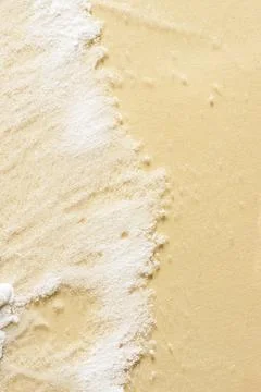 White powder on beige background Stock-Fotos