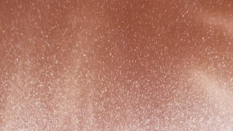 White powder dust particles exploding on a brown background Vídeos de archivo 343938639