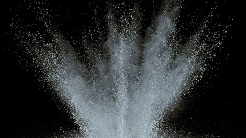 White powder exploding on black background in super slow motion, shot with Stock Footage