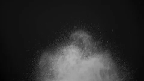 White powder exploding isolated on black Stock Footage 74933103