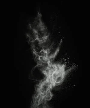 White powder exploding isolated on black Stock Photos