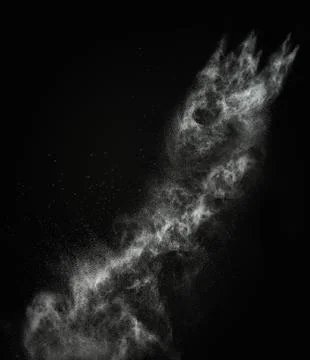 White powder exploding isolated on black Stock Photos