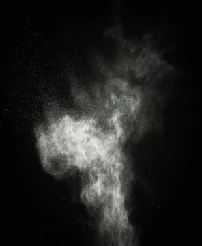 White powder exploding isolated on black Foto stock