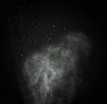 White powder exploding isolated on black Foto stock
